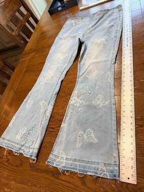 Jeans with butter fly prints flare leg XL